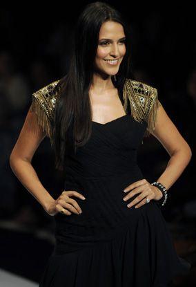 Neha Dupia presents a creation by Kavita Bhartia during the Wills India Fashion Week (WIFW) Spring Summer 2010 in New Delhi on October 25, 2009