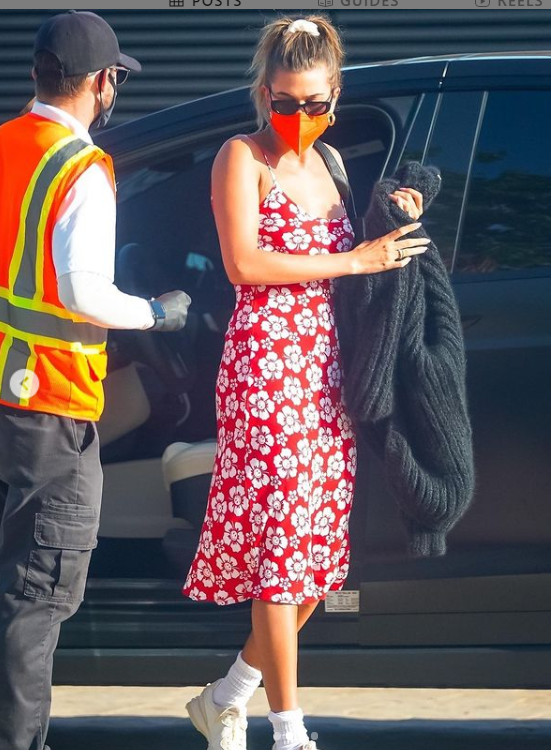 Hailey Bieber paired her Hawaiian-print slip dress with white sneakers -  Masala